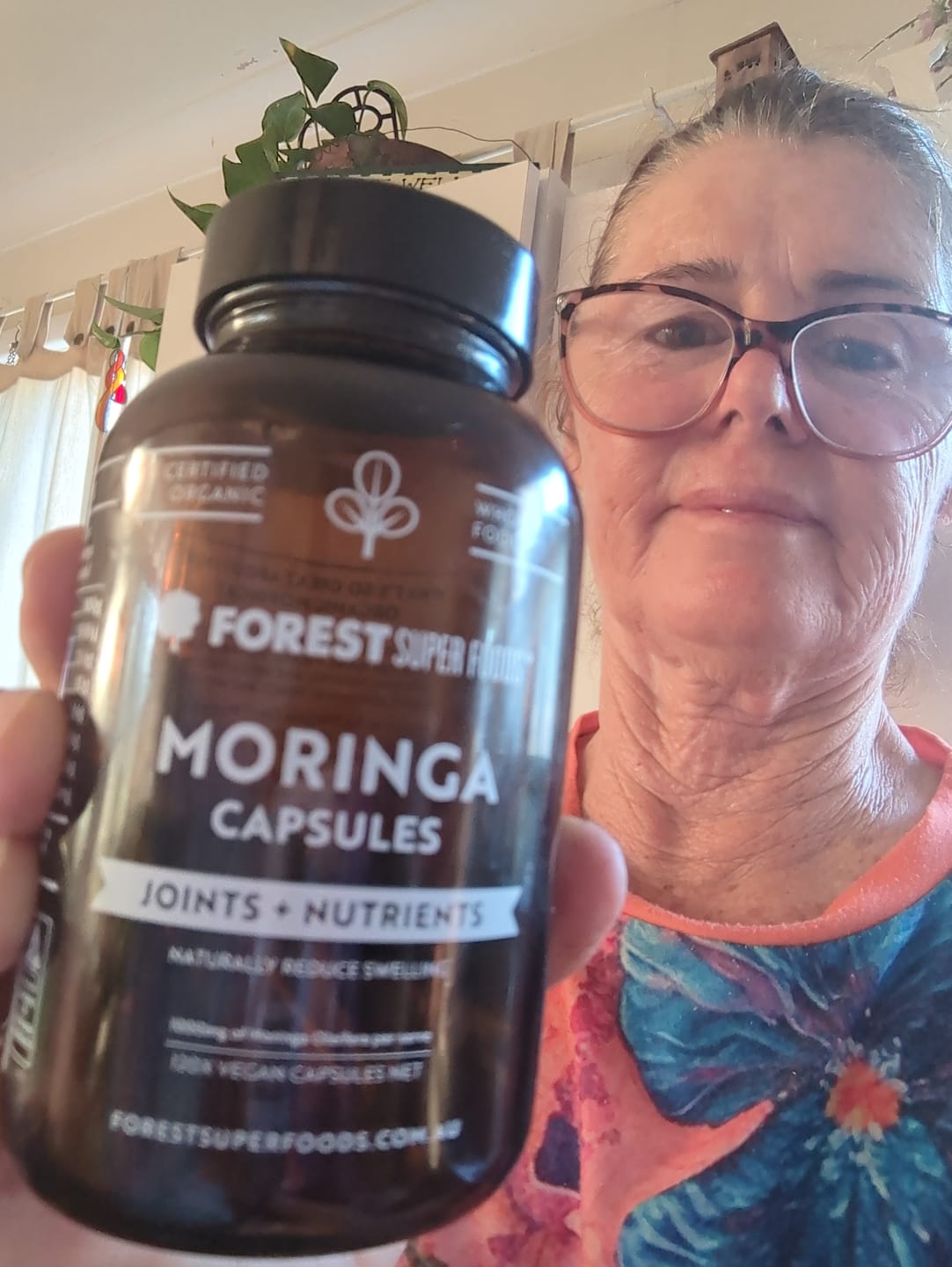 Customer image featuring a bottle of Organic Moringa Capsules.